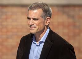 Fotis Dulos Smirking;