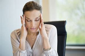 Woman Resting Her Hands On The Side of Her Head;